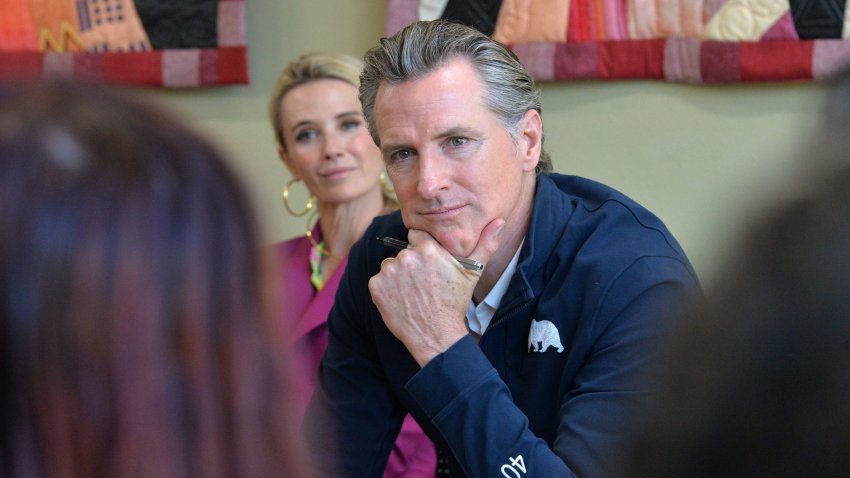 California Gov. Gavin Newsom and First Partner Jennifer Newsom, listen to students from New College of Florida on Wednesday during Newsom's stop at the Betty J. Johnson North Sarasota Public Library in Sarasota on April 5, 2023.