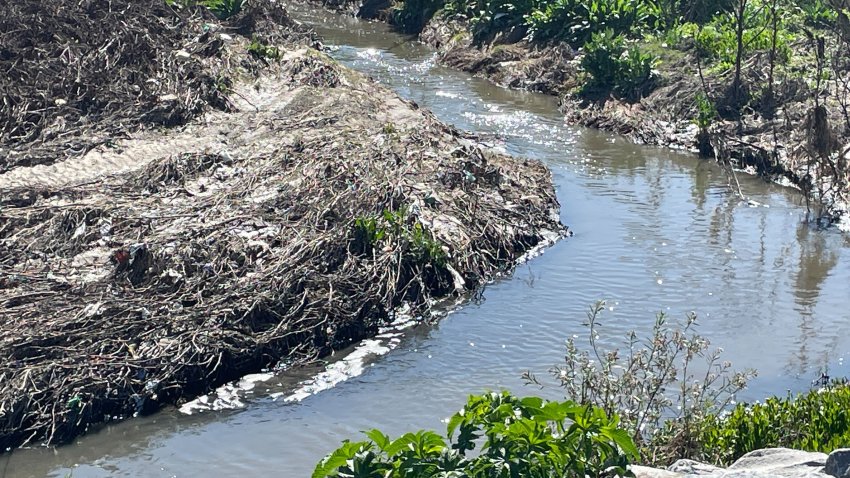 River and trash on the banks.