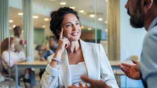 Business woman and businessman talking during meeting or job interview in the office. Business team Discussing new ideas and strategy for success. Business partners brainstorming
