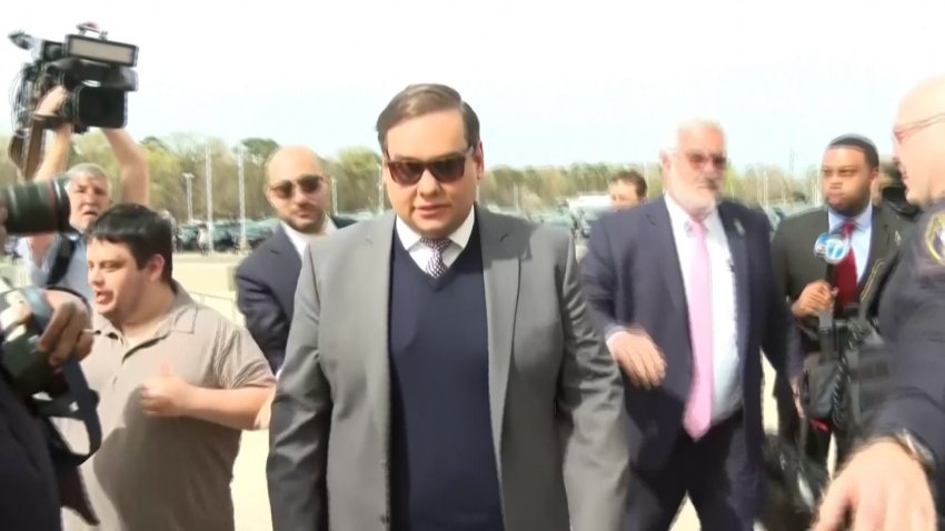 George Santos walking toward a federal courthouse.