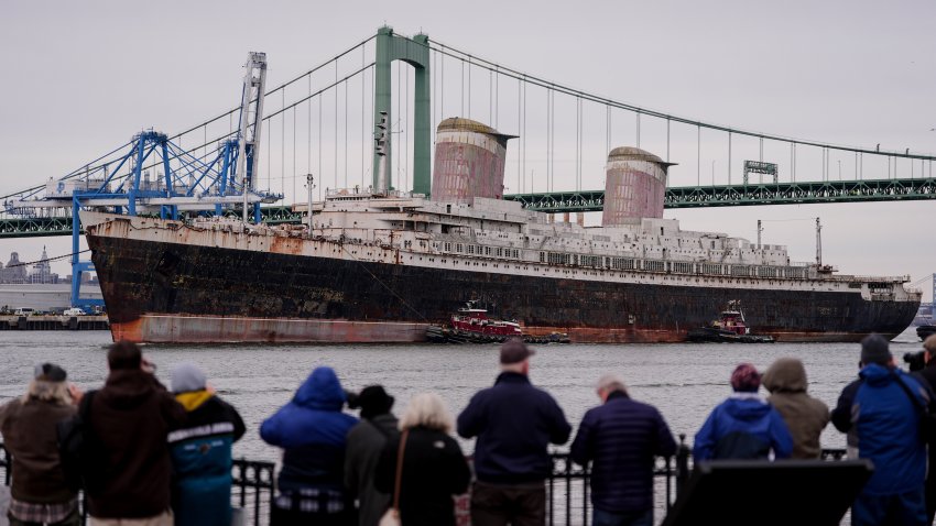 The SS United States is towed along the Delaware River between Pennsylvania and New Jersey, from Philadelphia, Feb. 19, 2025.