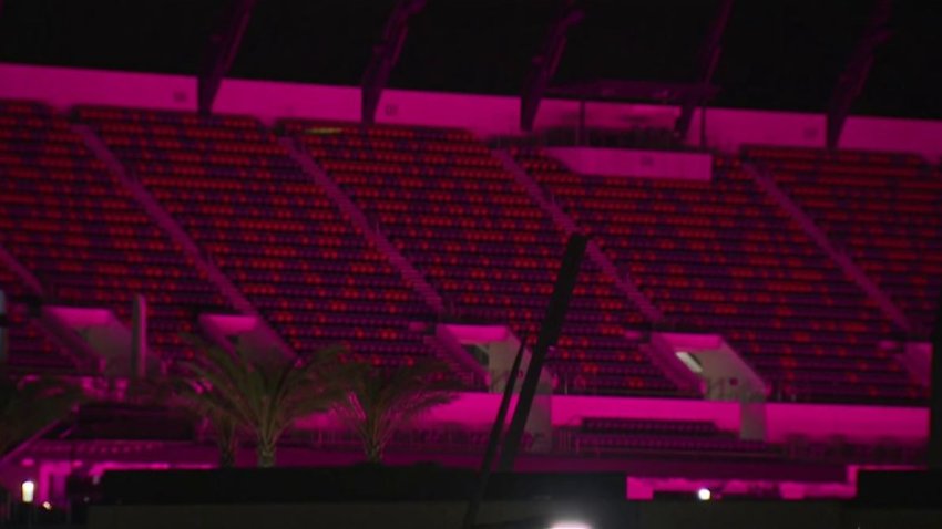 Snapdragon Stadium glowing pink with grow lights
