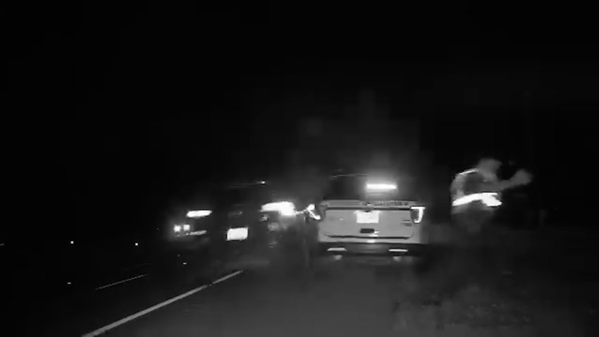 An SUV hitting the back of a police car.