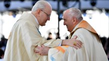 Pope Francis greets archbishop of Budapest cardinal Péter Erdő (L) during a Mass at Kossuth Lajos Square on April 30, 2023 in Budapest, Hungary.