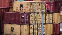 BREMERHAVEN, GERMANY – APRIL 22: Containers are stacked at the container terminal of Bremerhaven port on April 22, 2025 in Bremerhaven, Germany. Industry and logistics are facing continued uncertainty over the tariffs policy of U.S. President Donald Trump. While Trump has imposed a 25% tariff on European cars and auto parts imports, he has also suggested he may rescind these tariffs in some form. He said too he expects to reach a “deal” with the EU over tariffs soon.