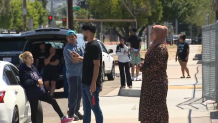 Parents waiting outside El Cajon Valley High School on Thursday after a shooting was reported nearby the campus.