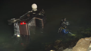 A vehicle being pulled out of the water at San Diego's Harbor Island on April 10, 2025.