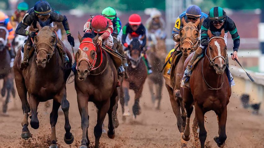 Mystik Dan, with Brian Hernandez Jr. up, right, wins the 150th running of the Kentucky Derby, in a three-way photo finish over second place Sierra Leone and third place Forever Young at Churchill Downs on Saturday, May 4, 2024, in Louisville, Kentucky. 