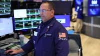 Traders work on the floor of the New York Stock Exchange during morning trading on May 07, 2025 in New York City.