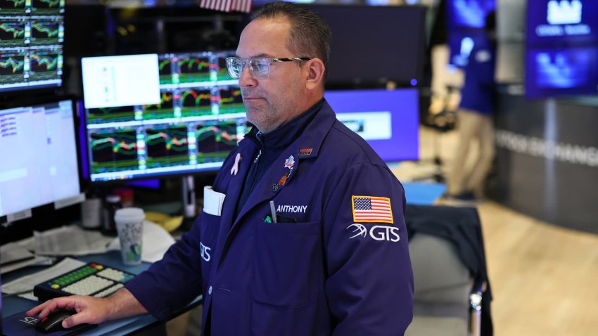 Traders work on the floor of the New York Stock Exchange during morning trading on May 07, 2025 in New York City.
