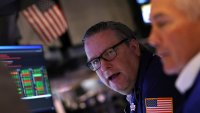 Traders work on the floor at the New York Stock Exchange in New York City, U.S., May 7, 2025.