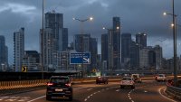 Motorists drive past as clouds gather over city skyline in Mumbai on September 26, 2024. (Photo by Punit PARANJPE / AFP) (Photo by PUNIT PARANJPE/AFP via Getty Images)