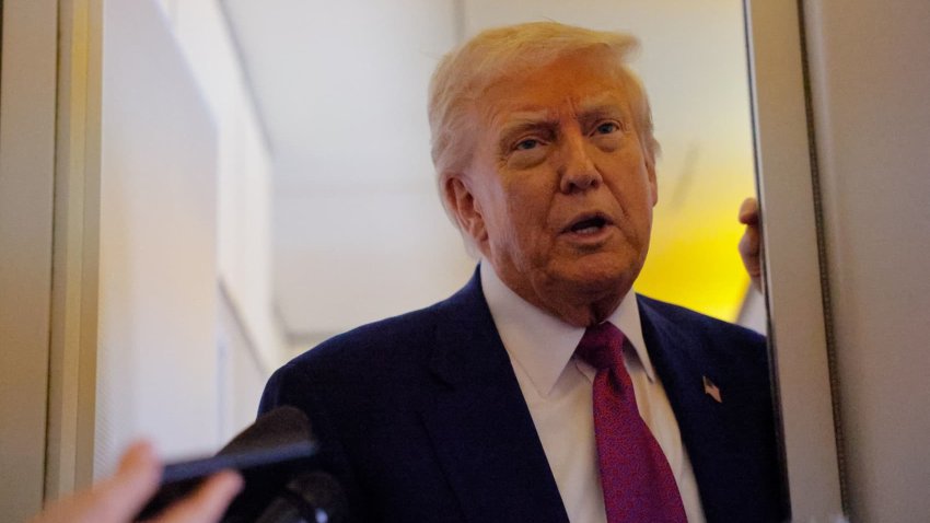 U.S. President Donald Trump talks to reporters aboard Air Force One, en route to Abu Dhabi, United Arab Emirates, on May 15, 2025.