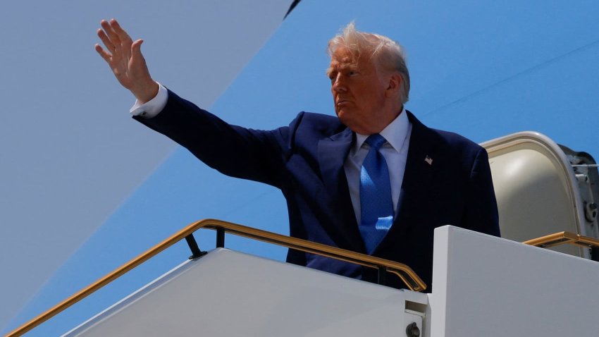 U.S. President Donald Trump gestures, while he boards Air Force One, in Abu Dhabi, United Arab Emirates, May 16, 2025.
