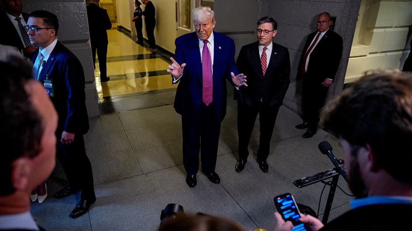 U.S. President Donald Trump, accompanied by Speaker of the House Mike Johnson, speaking to the media as he departs a House Republican meeting at the U.S. Capitol on May 20, 2025, in Washington, D.C.
