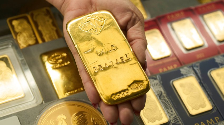 Sam Nguyen shows a gold bar