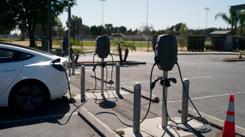 FILE - Electric vehicle chargers are seen in the parking lot of South El Monte High School in South El Monte, Calif., Aug. 26, 2022.