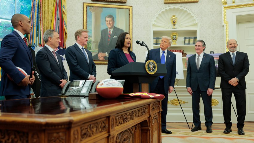Mayor Muriel Bowser speaks alongside President Donald Trump during an event on the NFL Draft in the Oval Office of the White House on May 5, 2025, joined by, (L-R) Housing and Urban Development Secretary Scott Turner, Washington Commanders owner Josh Harris, NFL Commissioner Roger Goodell, Interior Secretary Doug Burgum.