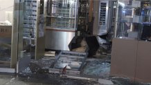 Video of the scene shows officers walking through a sea of broken glass to investigate the scene, the storefront blown out entirely by the vehicle that crashed into it.