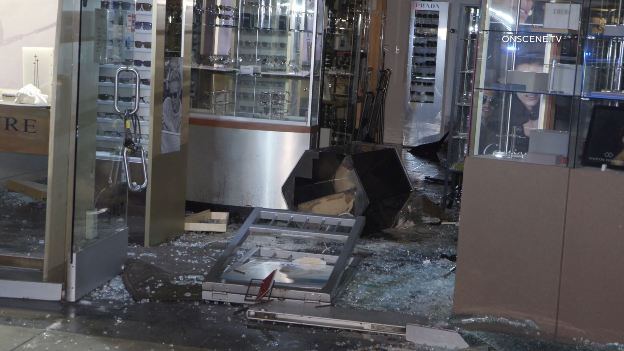 Video of the scene shows officers walking through a sea of broken glass to investigate the scene, the storefront blown out entirely by the vehicle that crashed into it.