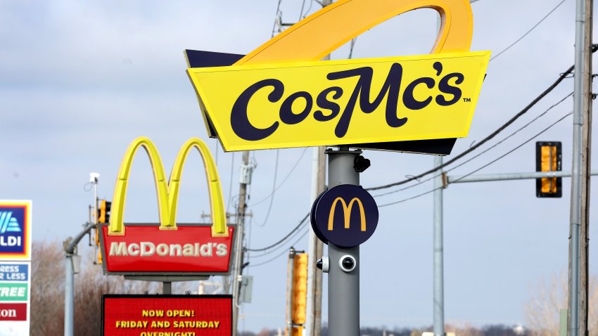 A sign hangs outside of a CosMc’s restaurant, a concept recently launched by McDonald’s on December 11, 2023 in Bolingbrook, Illinois. Lines to order food and beverages at the drive-thru-only restaurant, which opened to the public late last week, have been as long as 6 hours.