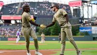 DENVER, CO – MAY 09: Fernando Tatis Jr. #23 of the San Diego Padres high-fives Jackson Merrill #3 after scoring a run in the top of the first inning during the game between the San Diego Padres and the Colorado Rockies at Coors Field on Friday, May 9, 2025 in Denver, Colorado. (Photo by Dustin Bradford/MLB Photos via Getty Images)