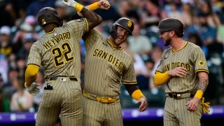 DENVER, CO β MAY 10: San Diego Padres outfielder Jason Heyward (22) celebrates his fourth inning three-run home run with Gavin Sheets (30) and Jackson Merrill (3) during a game between the San Diego Padres and the Colorado Rockies at Coors Field on May 10, 2025 in Denver, Colorado. (Photo by Dustin Bradford/Icon Sportswire via Getty Images)