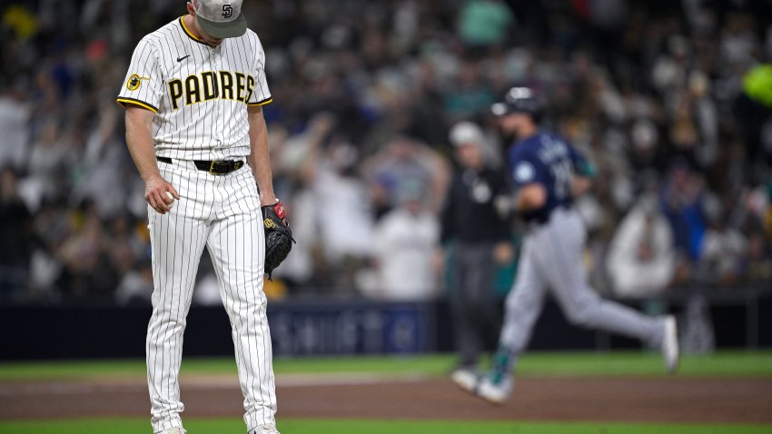 SAN DIEGO, CALIFORNIA – MAY 16: Stephen Kolek #32 of the San Diego Padres reacts on the mound as Cal Raleigh #29 of the Seattle Mariners rounds the bases after hitting a two-run home run during the sixth inning at Petco Park on May 16, 2025 in San Diego, California. (Photo by Orlando Ramirez/Getty Images)