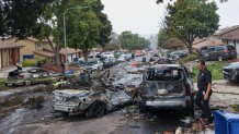 On May 22, 2025, the investigators look through the site where a small plane on a street in San Diego, California, has crashed. The Federal Aviation Authority said a Cessna 550 fell around 3:45 am local time. The neighborhood is located near the Montgomery Gibbs Executive Airport. The crash left a "Gigantic rubble field" And damage around 15 houses and parked cars, ABC News quoted the deputy fire chief of San Diego. (Photo by Sandy Huffaker / AFP) (Photo by Sandy Huffaker / AFP via Getty Images)
