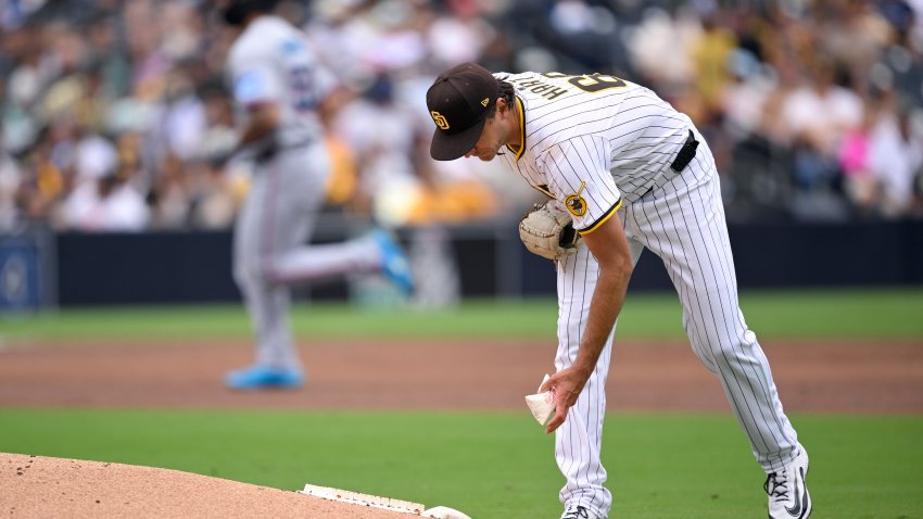 SAN DIEGO, CALIFORNIA – MAY 28: Kyle Hart #68 of the San Diego Padres grabs the rosin bag as Agustin Ramirez #50 of the Miami Marlins rounds the bases after hitting a home run during the third inning at Petco Park on May 28, 2025 in San Diego, California. (Photo by Orlando Ramirez/Getty Images)