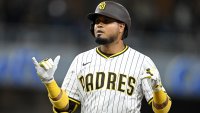 May 27, 2025; San Diego, California, USA; San Diego Padres first baseman Luis Arraez (4) getures after hitting and RBI single during the fourth inning against the Miami Marlins at Petco Park. Mandatory Credit: Denis Poroy-Imagn Images
