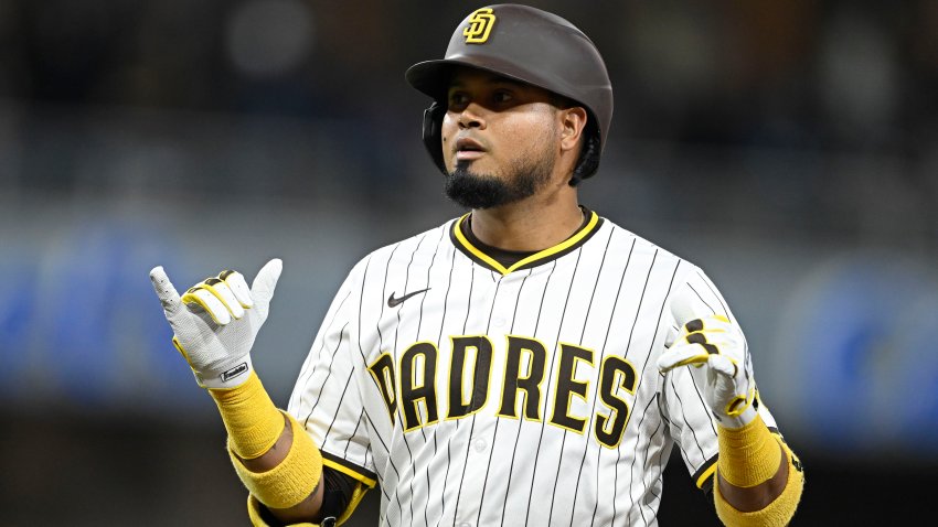 May 27, 2025; San Diego, California, USA; San Diego Padres first baseman Luis Arraez (4) getures after hitting and RBI single during the fourth inning against the Miami Marlins at Petco Park. Mandatory Credit: Denis Poroy-Imagn Images
