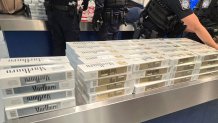 Hundreds of cartons of contraband cigarettes were seized from two passengers arriving April 17 in Southern California on a cruise ship.