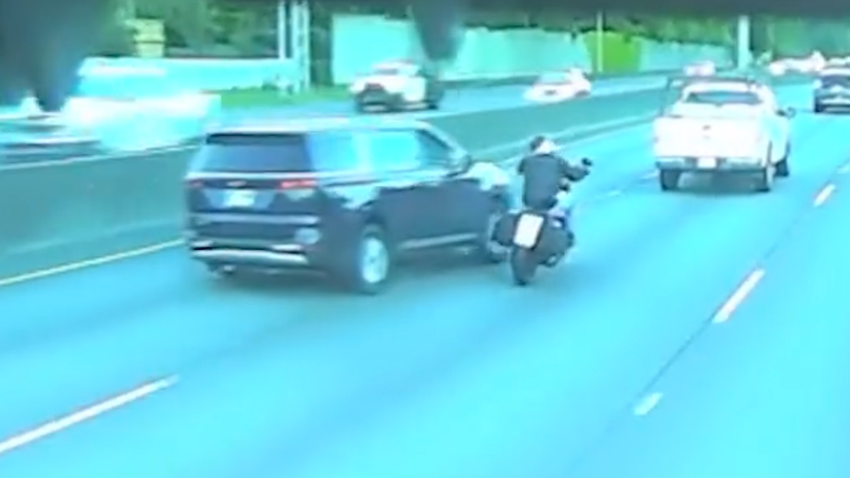 Dashcam image showing Kia minivan driving into motorcyclist on Oregon freeway