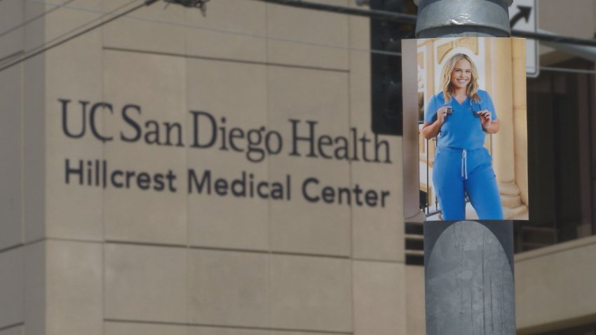 Picture of a nurse in front of a hospital