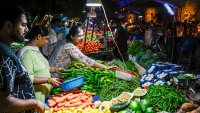 People buying vegetables at a local market in Noida, Uttar Pradesh on August 22, 2023. (Photo by Chandradeep Kumar/ The India Today Group via Getty Images)