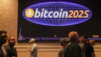Attendees walk past a sign during The Bitcoin Conference at The Venetian Las Vegas in Las Vegas, Nevada, on May 27, 2025.