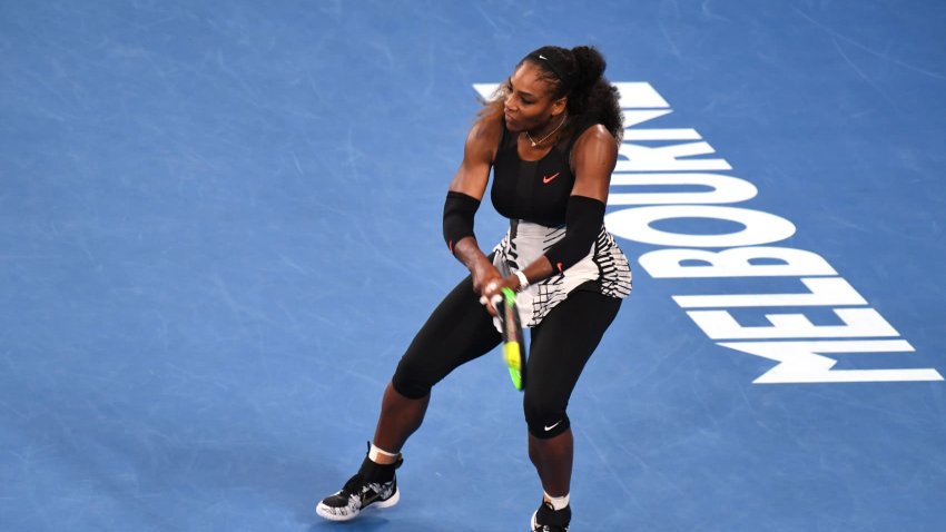 Serena Williams of the US hits a return against Venus Williams of the US during the women’s singles final on day 13 of the Australian Open tennis tournament in Melbourne on January 28, 2017.