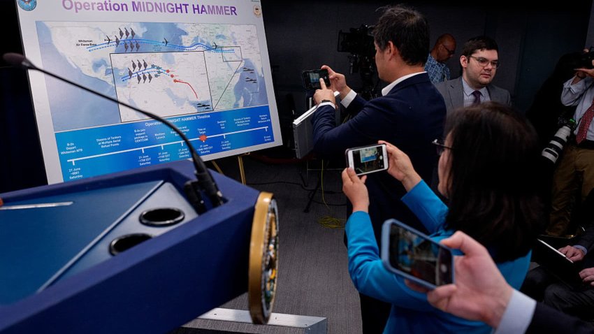 Reporters photograph an operational timeline of a strike on Iran at the Pentagon on June 22, 2025, in Arlington, Virginia, U.S.
