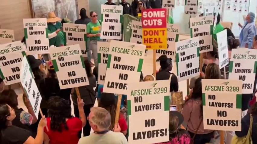 Workers rally after UC San Diego Health announces layoffs