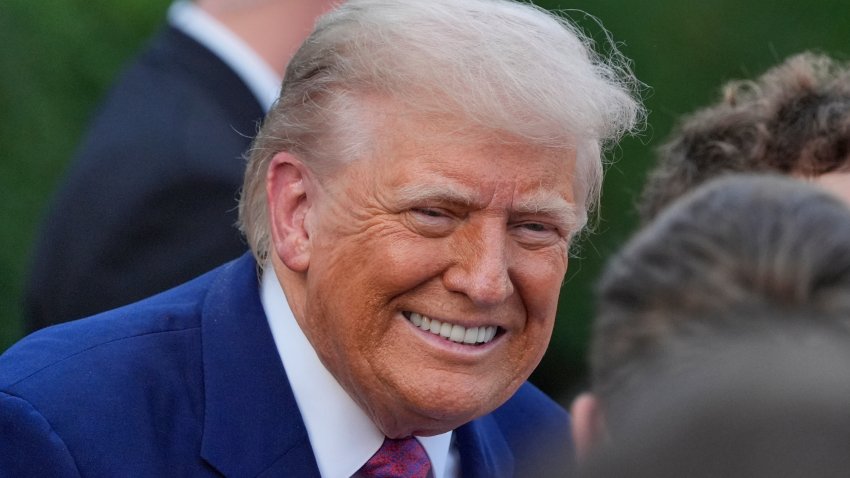 President Donald Trump greets guests during the congressional picnic on the South Lawn of the White House, Thursday, June 12, 2025, in Washington.