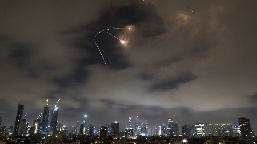 Israeli air defense system fires to intercept missiles during an Iranian attack over Tel Aviv, Israel, Saturday, June 21, 2025.