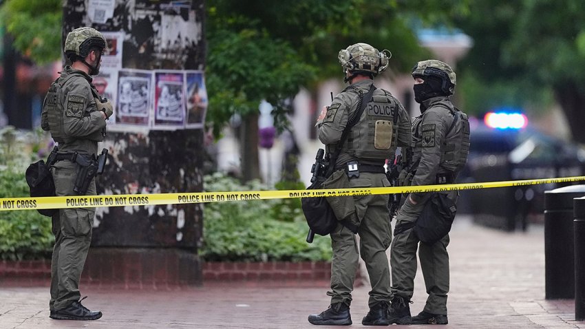 Law enforcement officials investigate after an attack on the Pearl Street Mall, Sunday, June 1, 2025, in Boulder, Colo.