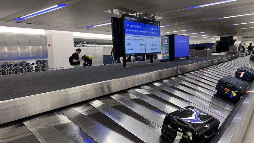Baggage claim area with conveyor belt and passengers collecting luggage at Newark Liberty International Airport, Newark, New Jersey, October 19, 2024. (Photo by Smith Collection/Gado/Getty Images)