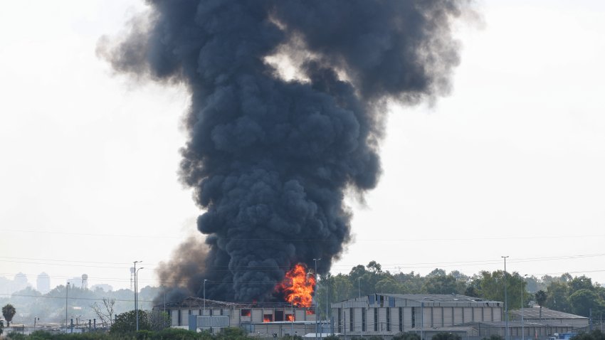 Smoke billows from a fire in a building in Herzliya near Tel Aviv following a fresh barrage of Iranian rockets on June 17, 2025. Israel’s military said air raid sirens sounded in several areas of the country on June 17 after identifying missiles launched from Iran, as AFP journalists reported booms over Tel Aviv and Jerusalem.