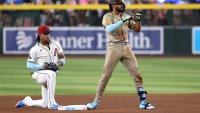 PHOENIX, ARIZONA – JUNE 15: Fernando Tatis Jr. #23 of the San Diego Padres reacts in front of Ketel Marte #4 of the Arizona Diamondbacks after hitting an RBI double during the seventh inning against the Arizona Diamondbacks at Chase Field on June 15, 2025 in Phoenix, Arizona. (Photo by Chris Coduto/Getty Images)