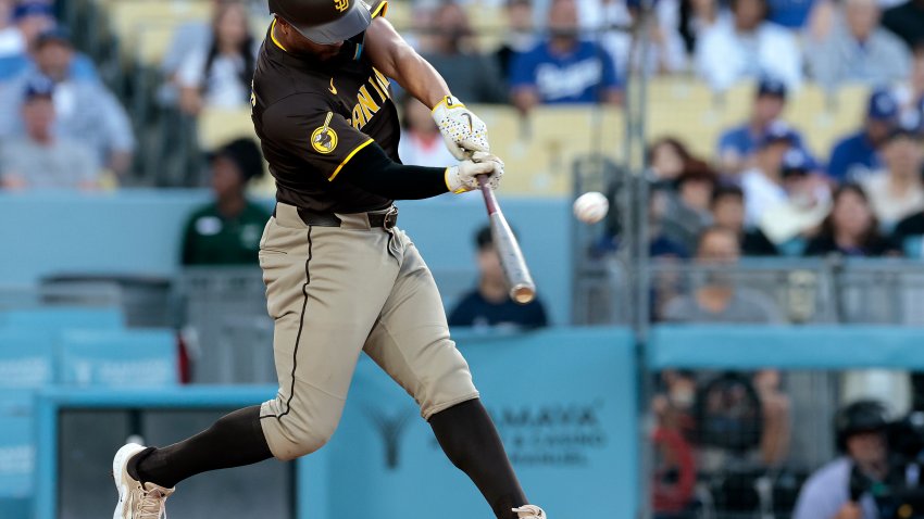 LOS ANGELES, CALIFORNIA – JUNE 19: Xander Bogaerts #2 of the San Diego Padres hits a home run against the Los Angeles Dodgers in the second inning at Dodger Stadium on June 19, 2025 in Los Angeles, California. (Photo by Ronald Martinez/Getty Images)