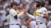 SAN DIEGO, CALIFORNIA – JUNE 21: Fernando Tatis Jr. #23 of the San Diego Padres is congratulated by Manny Machado #13 after hitting a three-run home run against the Kansas City Royals during the seventh inning at Petco Park on June 21, 2025 in San Diego, California. (Photo by Orlando Ramirez/Getty Images)