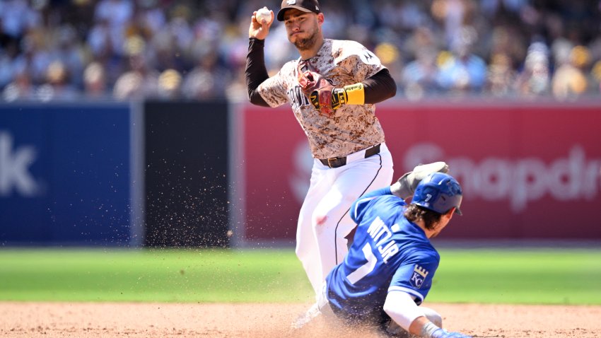 SAN DIEGO, CALIFORNIA – JUNE 22: Jose Iglesias #7 of the San Diego Padres throws to first base after forcing out Bobby Witt Jr. #7 of the Kansas City Royals at second base to complete a double play during the eighth inning at Petco Park on June 22, 2025 in San Diego, California. (Photo by Orlando Ramirez/Getty Images)