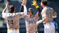 SAN DIEGO, CALIFORNIA – JUNE 22: Jose Iglesias (C) of the San Diego Padres is congratulated by Tyler Wade #14 and Jackson Merrill #3 after hitting a walk-off fielder’s choice in the ninth inning against the Kansas City Royals at Petco Park on June 22, 2025 in San Diego, California. (Photo by Orlando Ramirez/Getty Images)